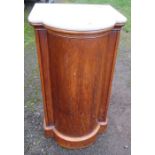 A Victorian marble topped pot cupboard, with barrel front, the door opening to reveal a shelf,