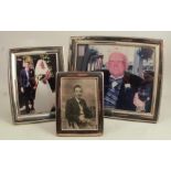 Two modern hallmarked silver mounted photograph frames, both with easel supports, together with a