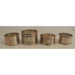 Three hallmarked silver napkin rings, together with a silver plated napkin ring