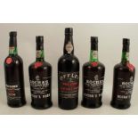 Three bottles of Rocha's Old Tawny port, a bottle of Offley 1968 vintage port and a bottle of 1979