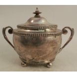 An Indian Colonial silver two handled sugar box, with cover, with wooden finial, having bands of