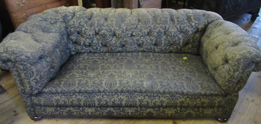 A Victorian deep button back Chesterfield, with drop end, width 84ins