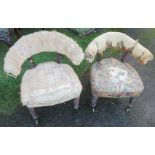 Two 19th century mahogany and upholstered chairs, of horseshoe form, with twisted supports to the