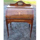 A Victorian rosewood ladies roll top bureau, with pull out hinged writing surface, pigeon holes
