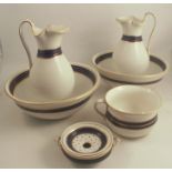 A Royal Worcester wash set, comprising two wash jugs, two bowls, a chamber pot and a soap dish,