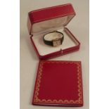Must De Cartier, a lady's silver gilt quartz wrist watch, with a cabochon set winding crown, on a