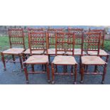 A set of eight country spindle back dining chairs, with rush seats, together with a similar carver