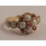 A 14 carat gold ruby and cultured pearl ring in the Victorian style, finger size P 1/2, 3.6g gross