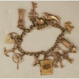 A 9ct gold charm bracelet, with eleven various charms, 27g all in