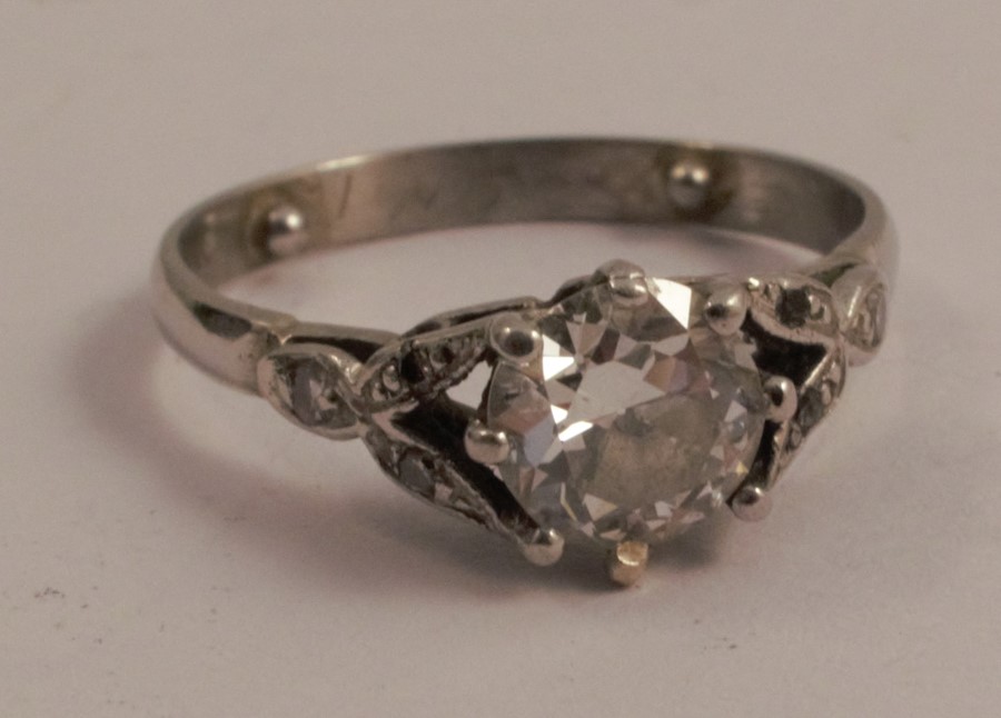 A platinum single stone diamond ring, the transitional cut stone of approximately 0.75 carats,