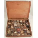 A fossil and mineral specimen collection, in a pine box with handwritten labels
