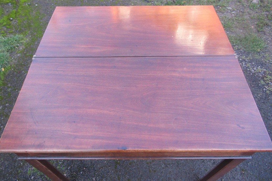 A 19th century mahogany fold over tea table, of rectangular form, with swing leg action, width - Image 2 of 4