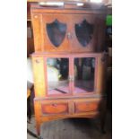 A 19th century mahogany display cabinet, having two main glazed doors, with two shield shaped glazed