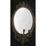 An oval gilt frame wall mirror, with Classical decoration with three scrolling candle branches,