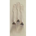 Three Scottish provincial silver fiddle pattern dinner forks, engraved with a crest and motto, maker