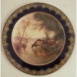 A Royal Worcester cabinet plate, decorated with cattle watering by John Stinton, to a blue and