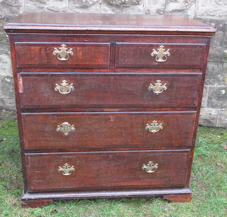 A 19th century oak chest, of two short over three long drawers, width 37.5ins x depth 21ins x height