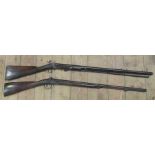 Two antique guns, both with mahogany stocks and engraved plates, and flintlock action