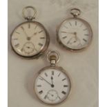 Three open face silver cased pocket watches, all with white enamel dials, makers Charles A Jones
