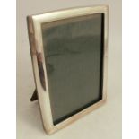 A silver mounted photograph frame, of rectangular form, with easel support, marked Sterling,