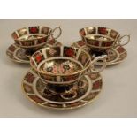 Three Royal Crown Derby cabinet cups and saucers, decorated in the 1128 Imari patternCondition