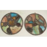 Two leaded stained glass circular panels, both inscribed Stained glass from the war damaged