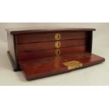 A Victorian mahogany fly cabinet, of rectangular form, with hinged drop flap revealing three drawers