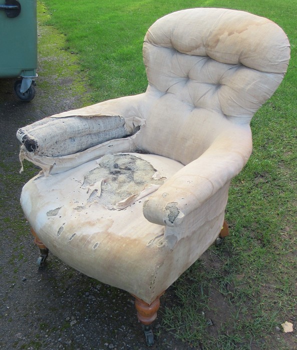 A Victorian upholstered armchair, with button back, on turned front supports, stamped C Hindley & - Image 2 of 4