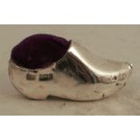 A silver novelty pin cushion, formed as a clog, Birmingham 1906, maker Levi & Salaman