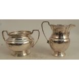 A silver jug, and matching two handled sugar bowl, with band of decoration, Birmingham 1937,