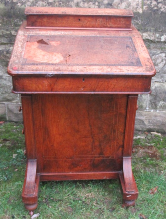 A late 19th century burr walnut davenport, having a stationery compartment, and four drawers and