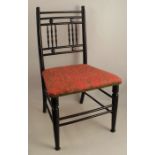 A late 19th century Arts and Crafts ebonised beech child's chair, in the manner of Morris & Co