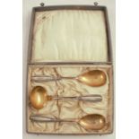 A cased set of silver cutlery, comprising a pair of spoons and a ladle, marked 800, weight