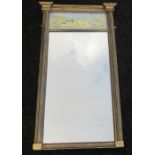 A 19th century gilt framed wall mirror, the milk glass frieze decorated in gilt with a building in