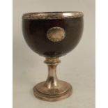 A Scottish provincial silver mounted coconut cup, the coconut shell bowl with silver rim and oval