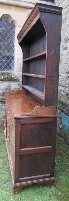 A Georgian cupboard dresser, with an associated close boarded Delft rack over three frieze - Image 3 of 7