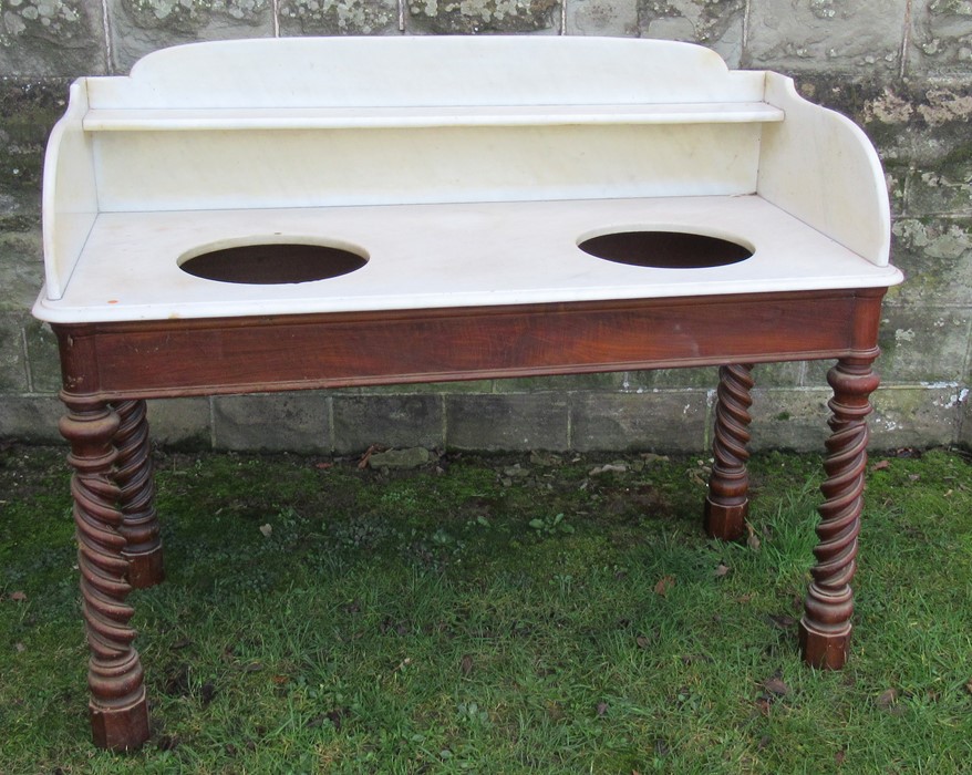 A Victorian walnut marble topped wash stand, with marble shelf to the gallery back and sides, with