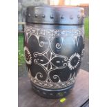 A pottery barrel, with incised decoration, height 14ins, diameter 9ins
