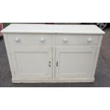 A 19th century painted pine cupboard dresser, having two drawers, with two cupboard doors below,