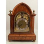 An Edwardian mahogany and satinwood mantel clock, with eight day movement, gilt dial with silver