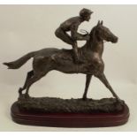 A 20th century bronze model, of a horse and jockey, label to underside Green Bopper winner of