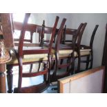 A harlequin set of six 19th century bar back dining chairs, four having tulip decoration