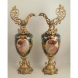 A large pair of 20th century painted glass and gilt metal ewers, the bodies decorated with female