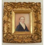 An early 19th century miniature, gentleman in period dress, inscribed to the reverse, Beau