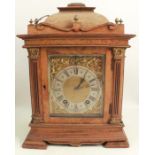 A walnut and mahogany cased mantel clock, the chiming movement stamped Lenzkirch, with gilt dial and