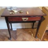 A Georgian mahogany fold over side table, raised on turned legs with pad feet, width 17ins (