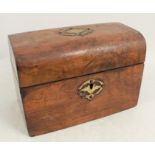 A Victorian walnut domed top tea caddy, with gilt metal mounts, the interior fitted with two covered