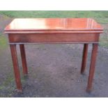 A 19th century mahogany fold over tea table, of rectangular form, with swing leg action, width