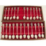 A cased set of twenty-three Japanese Sterling silver coffee spoons, each spoon with either flower,