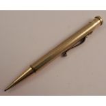 A yellow metal propelling pencil